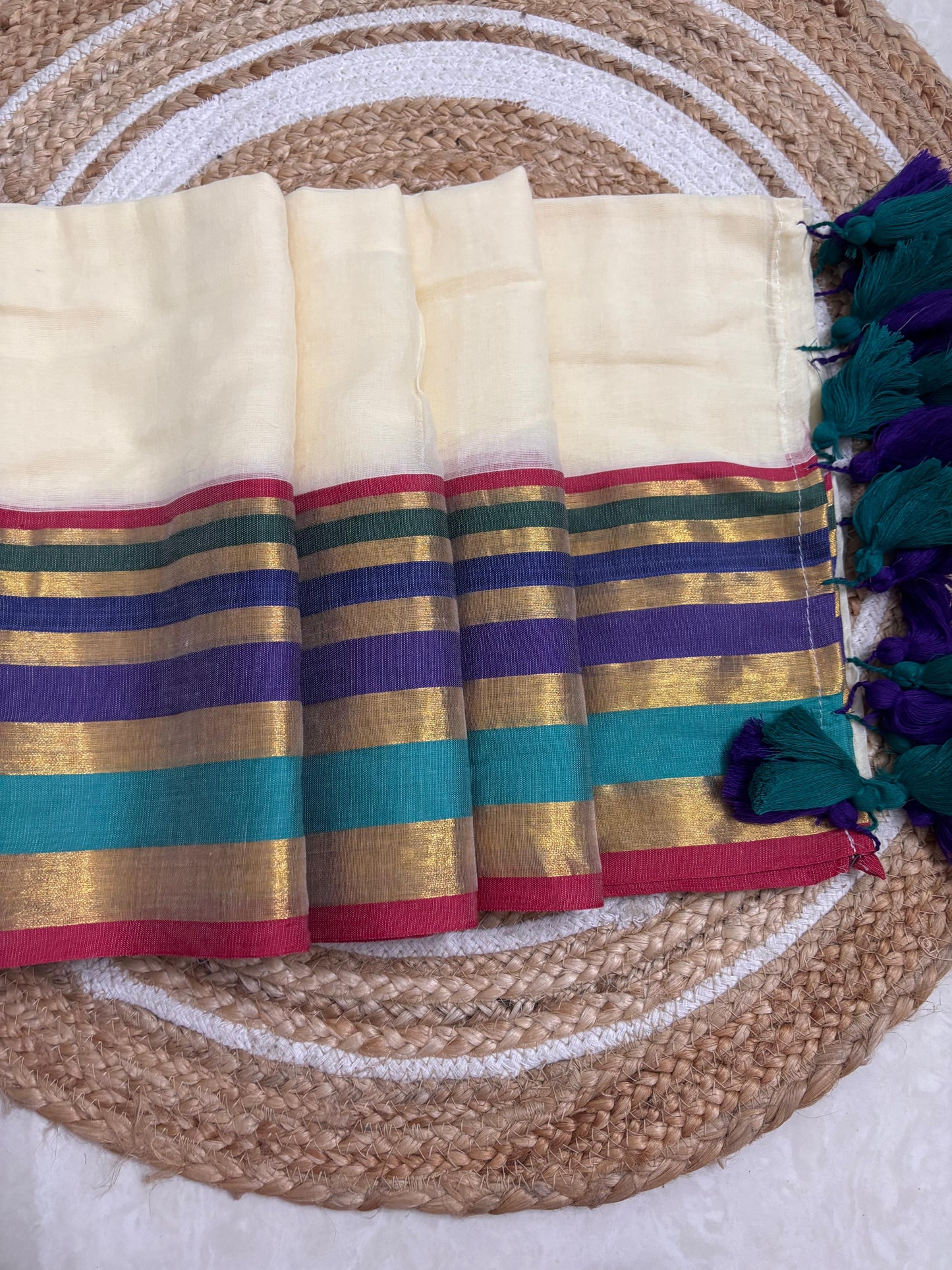Mridula - Offwhite Mulmul saree with multicoloured Kara-Kasavu Border