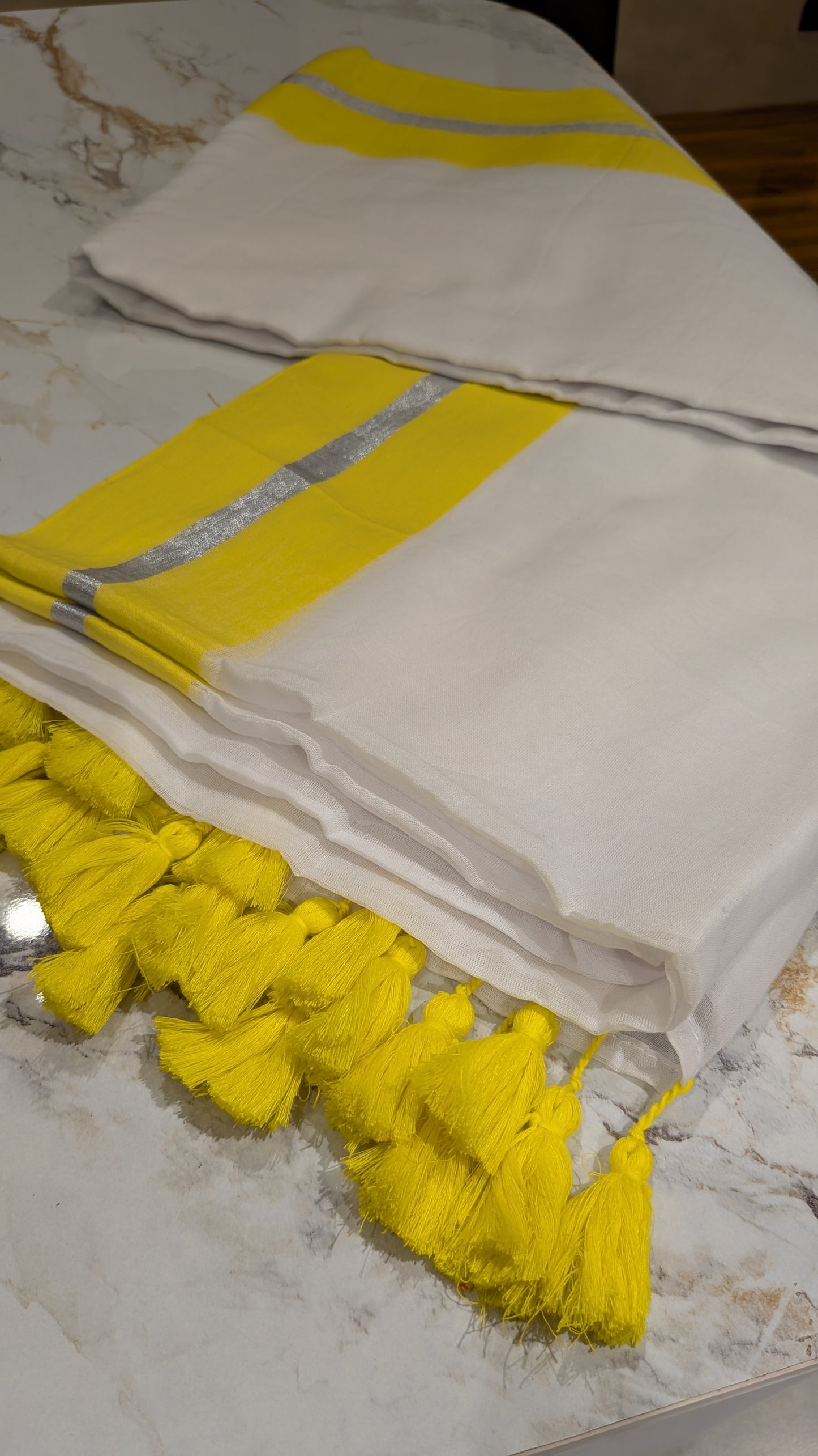 Mridula - Yellow and Silver Border white Mulmul saree